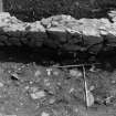 Excavation photograph : area N - general view of completely excavated linear cut under wall 908.