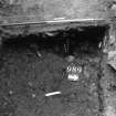 Excavation photograph : area N - slot cut through 988 with posthole 990 in base.