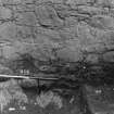 Excavation photograph : area N - French prison vaults - detail of wall footing on bedrock.