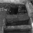 Excavation photograph : area K - E-W partition walls of detention cell exposed to foundation base.
