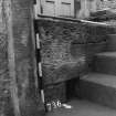 Excavation photograph : area K - detail of ventilation slot at base of south wall of west staircase detention cell.