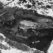 Excavation photograph : area M - polygonal cut under grave 1144 filled with mortar, cutting top of backfilled ditch.