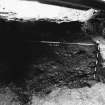 Excavation photograph : area L - S facing section through layers and features in angle between walls 816 and 820.