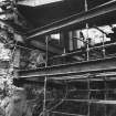 Excavation photograph : view in coalyard and through portal to shops.