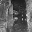 Excavation photograph: area X - NW view of flue arrangement beneath hearth.