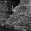 Excavation photograph: area X - south wall of storekeepers house and construction 1344, from south-east.