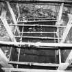 Excavation photograph: area X - hearth in NW corner of trench and rectangular stone.