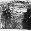 Excavation photograph : area T - trial trench, section through wall 1319 showing deposits on either side of wall.