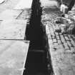 Excavation photograph : area BB - service trench location across hospital square.