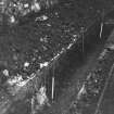 Excavation photograph : area BB - service trench in backwell yard with old toilet block walls.