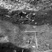 Excavation photograph: area X/H - low angle of W side of trench showing ditch to N of Charles II wall.