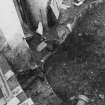 Excavation photograph : area G - N-S running wall overlain by 113 in SE corner of tattoo store.