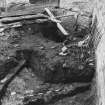 Excavation photograph : area J - E-W wall and angle running to S where it joins SW stable wall - overlain by drain 628?