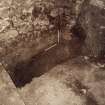 Excavation photograph : detail of wall 1066 and N-S wall of storekeepers house with plaster.