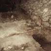 Excavation photograph : detail of wall 1066 and N-S wall of storekeepers house with plaster.