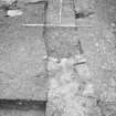 Dunfermline, Priory Lane, former Lauder Technical College, excavations.
Excavation photograph: trench 19 - surviving masonry of precinct wall F108 and its robber trench F188.