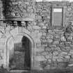Detail of doorway with protruding turret base above, Mains Castle, Caird Park, Dundee.