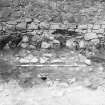 Excavation photograph - fireplace 12 in Room V