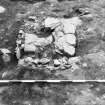 Excavation photograph - fireplace 18 in Room I from E