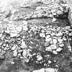 Excavation photograph - Room V from W showing 31 and T-shaped feature 39