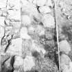 Excavation photograph - Room VI from S showing fireback of 23 and metalling 85