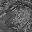 Excavation photograph : trench A - modern disturbance and flagged floor of Barmkin.