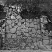 Excavation photograph : trench C - flagged floor F20 and walls F19 and F20.