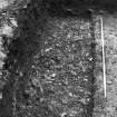 Excavation photograph : trench 2 - sondage B showing metalling F120.