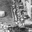 Excavation photograph : trench 2 showing drain channel being lifted, from N.