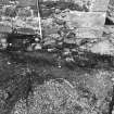 Excavation photograph : trench 2 showing wall foundations, from E.