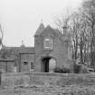 View of main gate and North Lodge, Hospitalfield House, Arbroath, from NW.