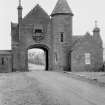 View of main gate and North Lodge, Hospitalfield House, Arbroath, from S.