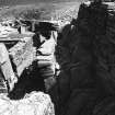 Slabs stacked in E.(?) side between outbuildings & Broch wall