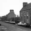 View looking east across Sinclair Street, from in front of Miller Institution, with 30 and 32
Sinclair Street in foreground