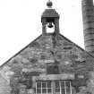 Gable end detail showing weather-cock, bell and inset Sutherland/Stafford arms