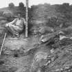 Earn's Heugh, forts and settlement.
Excavation photograph showing banks east and west.
Dr Margaret E C Stewart is in the photograph.