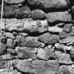 Excavation photograph: detail of masonry of beehive cell.