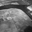East Field, Inveresk: oblique air photograph of enclosures, homestead, ring-ditch and pit alignment. Harding 78/001/5-6