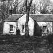 Copy of historic photograph showing general view of cottage.