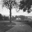 Copy of historic photograph showing distant general view.