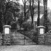 Copy of historic photograph showing view of gateway.