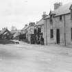 Copy of historic photograph showing view from NE.