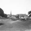 General view of Denholm showing Leyden Monument from S, with vintage cars.