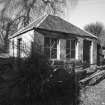 View of outbuilding from E