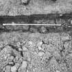 Excavation photograph - Trench I: vertical shot of fire-reddened slabs (Ik)- from N