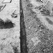 Excavation photograph - View along Trench 1 showing locations of grave markers Iq, Ir and Is