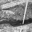 Excavation photograph - Section of cable track including tilting slabs (It) and the SE corner of recumbent slab (Iu) - from N