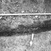 Excavation photograph - Trench I W extension showing section across mortar and stones - from N