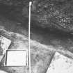 Excavation photograph - Trench III: opposite door leading onto basement of refectory, showing 1975 backfill - from N
