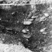 Excavation photograph : showing relationship of pit to feature 103 and deposits above.